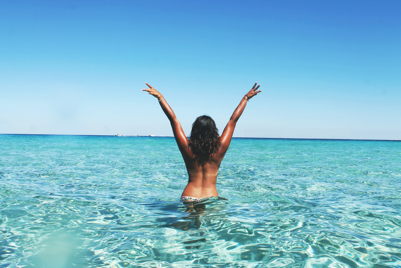 Woman Spreading her Arms in the Sea